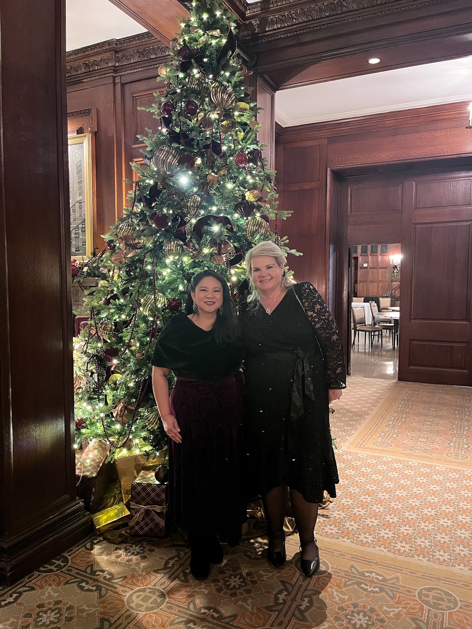 Lori Blewett and Dean Coleman in front of a Christmas tree