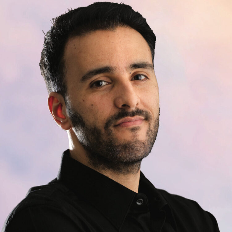 Man with dark hair and beard.